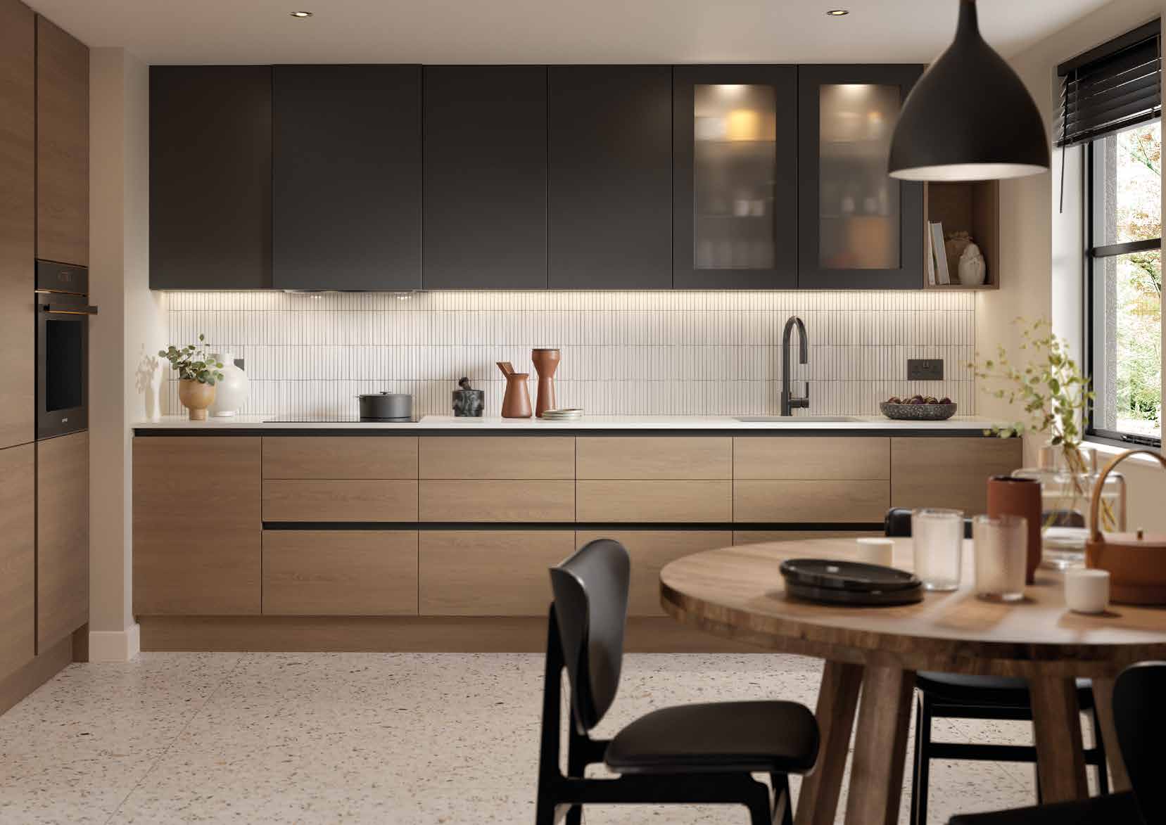 Modern handleless kitchen with graphite units and oak-effect cabinetry, by The Cabinet Door Shop in Hove